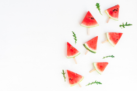 Watermelon popsicle. Sliced watermelon on white background. Flat lay, top viewの写真素材