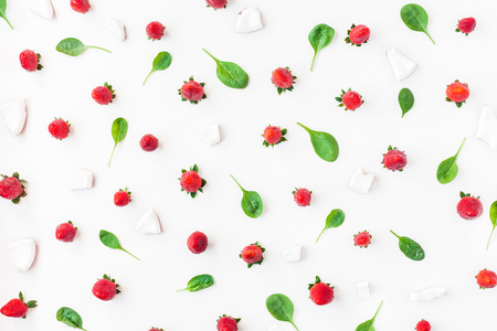 Fresh strawberry and coconut on white background. Fruit pattern. Summer concept. Flat lay, top viewの写真素材