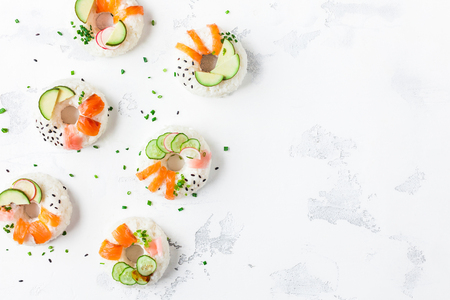 Sushi donuts set on white background. Sushi food trend. Flat lay, top view, copy spaceの写真素材