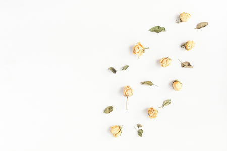 Flowers composition. Frame made of dried rose flowers. Top view, flat lay, copy spaceの写真素材