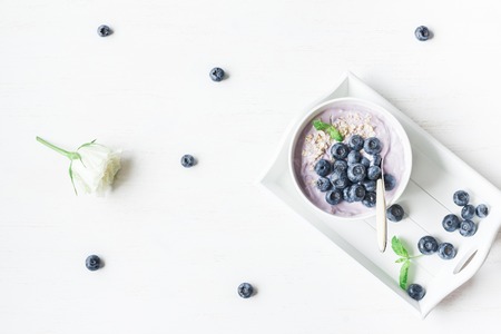 Healthy breakfast with yogurt, muesli and blueberry. Top view, flat layの写真素材