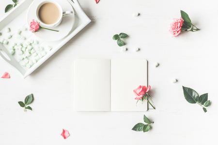 Cup of coffee and rose flowers. Morning. Vintage. Flat lay, top viewの写真素材