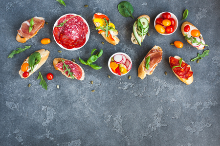 Traditional spanish tapas on black background. Flat lay, top viewの写真素材
