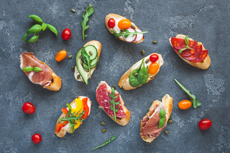 Traditional spanish tapas on dark background. Flat lay, top viewの写真素材