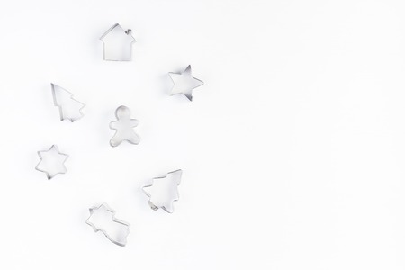 Cookie cutters on white background. Christmas, winter, new year concept. Flat lay, top view, copy spaceの写真素材