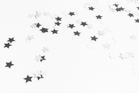 Christmas composition. Christmas paper confetti on white background. Top view, flat lay, copy spaceの写真素材