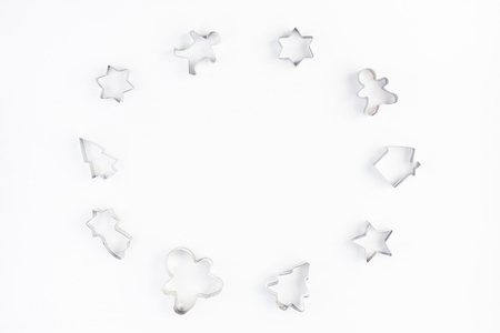 Cookie cutters on white background. Christmas, winter, new year concept. Flat lay, top view, copy spaceの写真素材