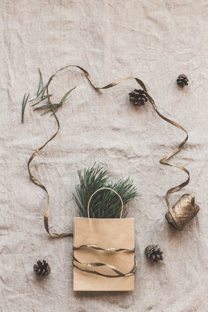 Christmas composition. Paper bag with fir branches. Flat lay, top viewの写真素材