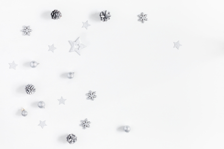 Christmas composition. Christmas silver decorations on white background. Flat lay, top view, copy spaceの写真素材