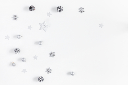 Christmas composition. Christmas silver decorations on white background. Flat lay, top view, copy space