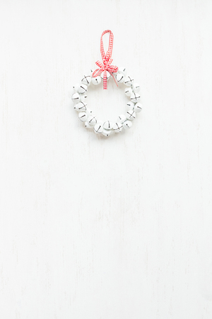 Wreath made of christmas bells. Christmas background. Flat lay, top viewの写真素材