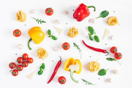 Ingredients for cooking pasta on white background. Fettuccine, fresh vegetables, cheese, mushrooms, spice. Italian food concept. Flat lay, top view, copy spaceの写真素材