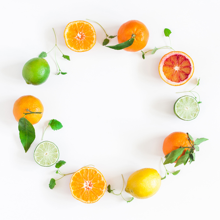 Fruit background. Colorful fresh fruits on white table. Orange, tangerine, lime, lemon, grapefruit. Flat lay, top view, copy space, squareの写真素材