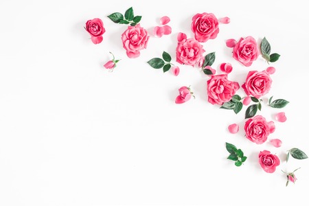 Flowers composition. Frame made of pink rose flowers on white background. Flat lay, top view, copy spaceの写真素材