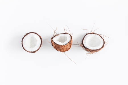 Coconut background. Fresh coconuts on white background. Flat lay, top viewの写真素材
