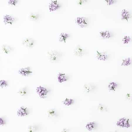 Flowers composition. Spring lilac flowers on white wooden background. Flat lay, top view, squareの写真素材