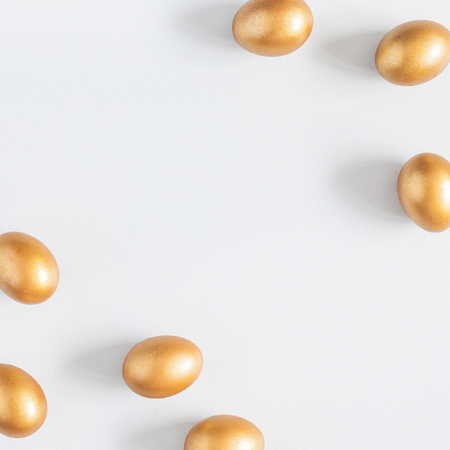 Easter golden eggs on gray background. Easter concept. Flat lay, top view, copy space, squareの写真素材