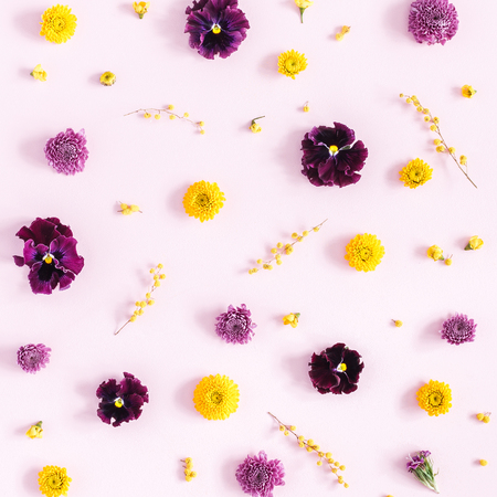 Flowers composition. Pattern made of colorful flowers on pink background. Flat lay, top view, squareの写真素材