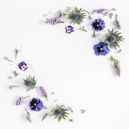 Flowers composition. Frame made of colorful flowers on gray background. Flat lay, top view, squareの写真素材