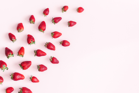 Strawberry on pastel pink background. Flat lay, top view, copy spaceの写真素材