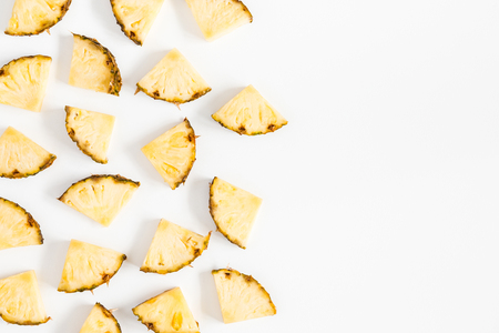 Pineapples pattern on white background. Summer concept. Flat lay, top viewの写真素材