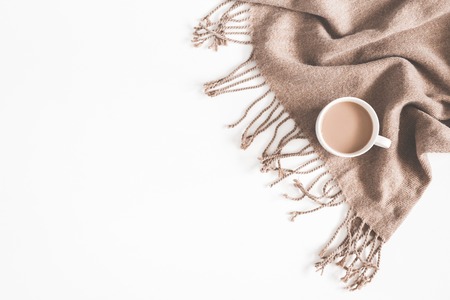 Autumn composition. Cup of coffee, plaid on white background. Autumn, fall concept. Flat lay, top view, copy spaceの写真素材