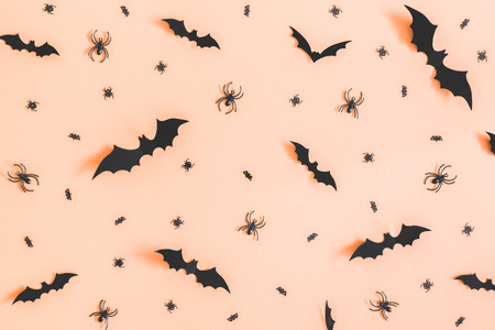 Halloween paper decorations on orange background. Halloween concept. Flat lay, top view