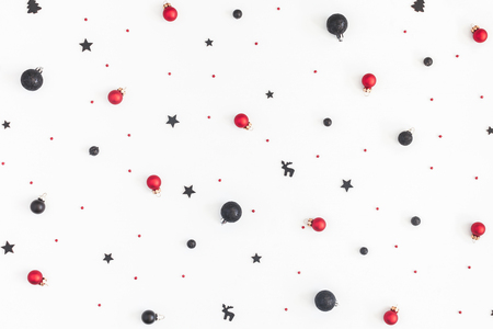 Christmas composition. Christmas black and red decorations on white background. Flat lay, top view, copy spaceの写真素材