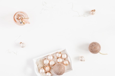 Christmas composition. Christmas balls, golden decorations on white background. Flat lay, top view, copy spaceの写真素材