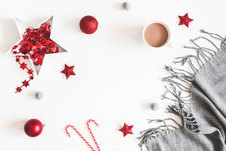 Christmas red decorations, plaid, cup of coffee on white background. Christmas, new year, winter concept. Flat lay, top view, copy spaceの写真素材