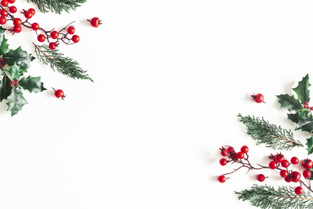 Christmas composition. Frame made of christmas plants on white background. Flat lay, top view, copy spaceの写真素材