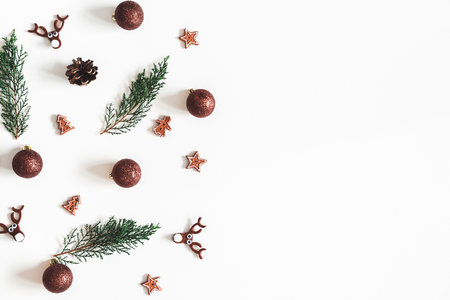 Christmas composition. Fir tree branches, decorations on white background. Christmas, winter, new year concept. Flat lay, top view, copy spaceの写真素材
