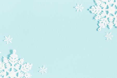 Christmas or winter composition. Pattern made of snowflakes on pastel blue background. Christmas, winter, new year concept. Flat lay, top view, copy spaceの写真素材