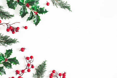 Christmas composition. Frame made of christmas plants on white background. Flat lay, top view, copy spaceの写真素材