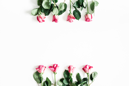 Flowers composition. Pink rose flowers on white background. Flat lay, top view, copy spaceの写真素材