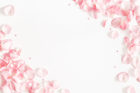 Flowers composition. Rose flower petals on white background. Valentine's Day, Mother's Day concept. Flat lay, top view, copy spaceの写真素材