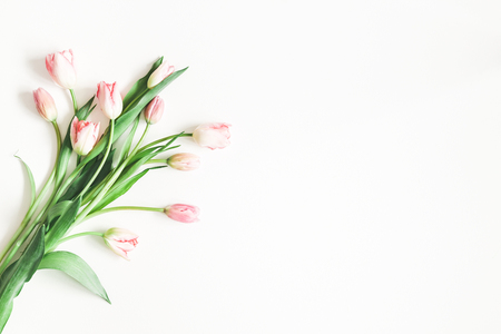 Flowers composition. Pink tulip flowers on white background. Valentines day, mothers day, womens day concept. Flat lay, top view, copy spaceの写真素材