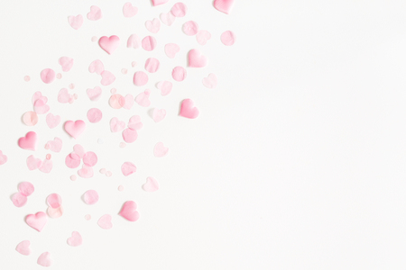 Valentine's Day background. Pink hearts on white background. Valentines day concept. Flat lay, top view, copy spaceの写真素材