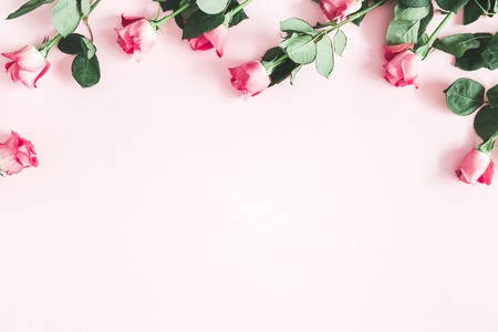 Flowers composition. Pink rose flowers on pastel pink background. Valentines day, mothers day, womens day concept. Flat lay, top view, copy spaceの写真素材