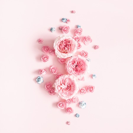 Flowers composition. Pattern made of rose flowers on pastel pink background. Valentines day, mothers day, womens day, spring concept. Flat lay, top view, squareの写真素材