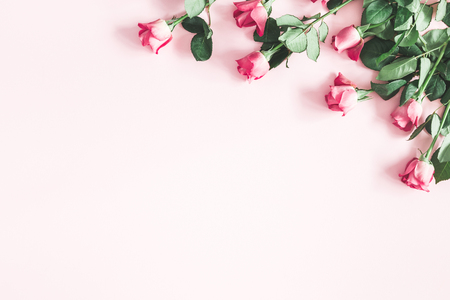 Flowers composition. Pink rose flowers on pastel pink background. Valentines day, mothers day, womens day concept. Flat lay, top view, copy spaceの写真素材