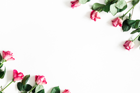 Flowers composition. Pink rose flowers on white background. Valentines day, mothers day, womens day concept. Flat lay, top view, copy spaceの写真素材