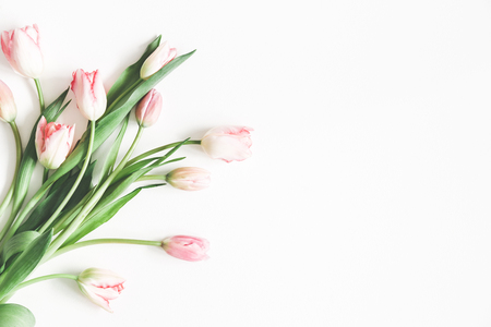 Flowers composition. Bouquet made of pink tulip flowers on white background. Valentines day, mothers day, womens day, spring, easter concept. Flat lay, top view, copy spaceの写真素材