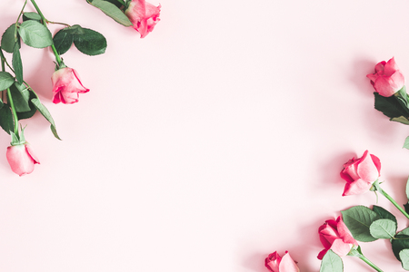 Flowers composition. Pink rose flowers on pastel pink background. Valentines day, mothers day, womens day concept. Flat lay, top view, copy spaceの写真素材
