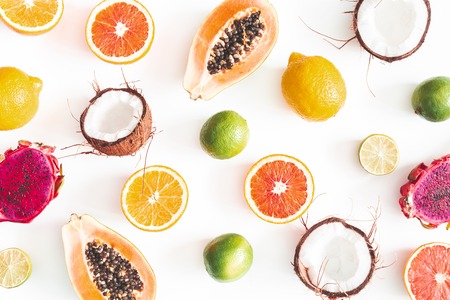 Fruit pattern on white background. Tropical fruits. Summer concept. Flat lay, top viewの写真素材