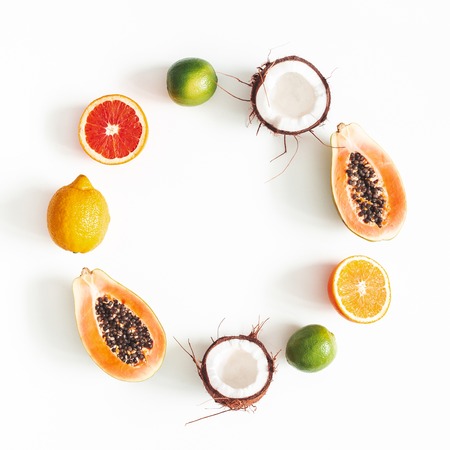 Fruit wreath on white background. Tropical fruits. Summer concept. Flat lay, top view, square, copy spaceの写真素材