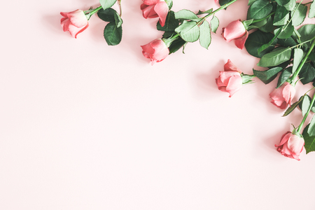 Flowers composition. Pink rose flowers on pastel pink background. Flat lay, top view, copy spaceの写真素材