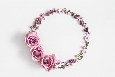 Flowers composition. Wreath made of purple flowers on gray background. Flat lay, top view, copy spaceの写真素材