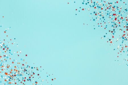 4th of July American Independence Day decorations on blue background. Flat lay, top view, copy spaceの写真素材