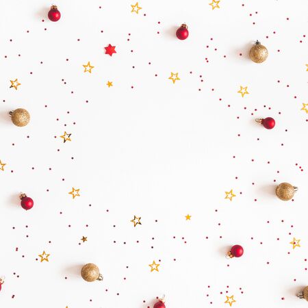 Christmas composition. Christmas red and golden decorations on white background. Flat lay, top view, copy space, squareの写真素材